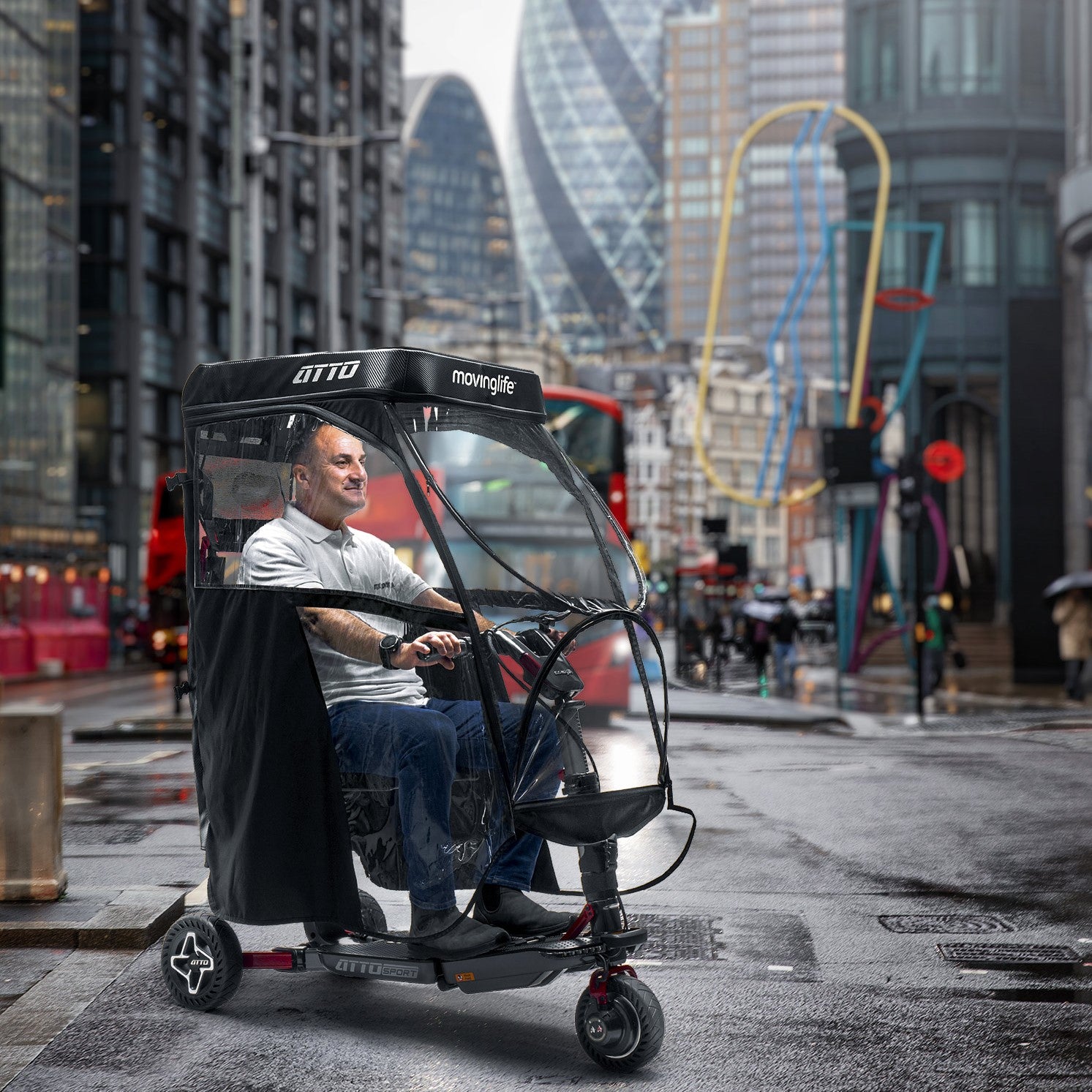 Man in Movinglife ATTO Sport mobility scooter with rain canopy